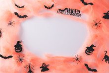 Top View Of Halloween Crafts, Orange Spider Web With Ghost, Bat And Spider On White Background With Copy Space For Text. Halloween Concept.