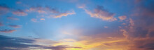 Panorama Of Beautiful Skyscape Clear Blue Sky And Golden Cloud Background During Sunset. Clearing Day And Good Weather In The Evening.