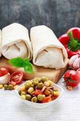 Canvas Print - A burrito - mexican dish that consists of a flour tortilla with various ingredients.