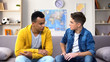 © motortion - Afro-American teen boy sharing problems with Caucasian friend, bullying problem