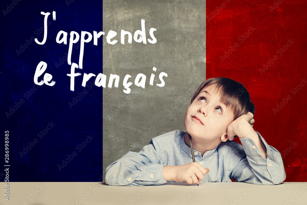 Learn french language concept. Happy child student and tittle "J - obrazy, fototapety, plakaty 
