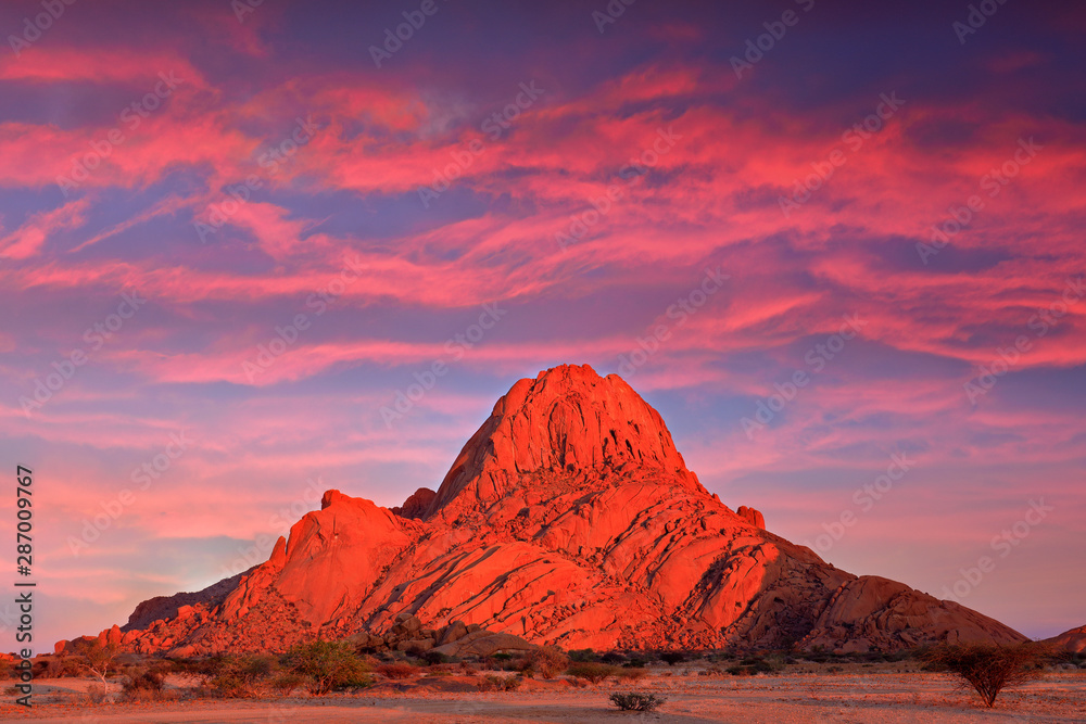 Spitzkoppe, beautiful hill in Namibia. Rock monument in the nature. Landscape in namibia. Stone in the nature, evening light in the rocky desert. Travel in Namibia, Africa. Große Spitzkoppe monument. - obrazy, fototapety, plakaty 