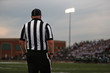 A football official during a Friday night high school football game