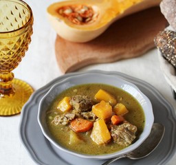 Wall Mural - thick soup with pumpkin and beef. hearty autumn dish