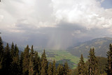 Fototapeta Na ścianę - a storm with rain and hail is coming in the mountains