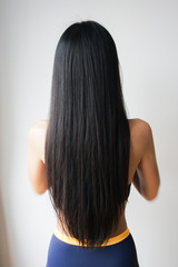 Woman with beautiful long straight black hair.