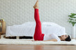 © 220 Selfmade studio - Happy Attractive Asian woman practice yoga leg raises pose with meditation smile with big belly after wake up in the morning Feeling so comfortable and relax,Healthcare Concept