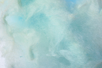 Sweet blue cotton candy as background, closeup view