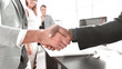 © ASDF - close up.architect and customer shaking hands in the main office