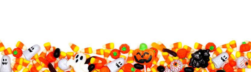 Wall Mural - Halloween candy long border. Top view isolated on a white background.