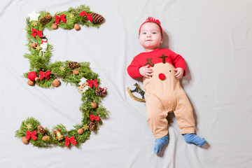 the child is five months old. 5 months old cute baby portrait. 5 digit offspring. Happy Baby Boy, Smiling Infant Kid Portrait, Five Months Old Child lying on Blue. Happy Baby Boy, Smiling Infant Kid P