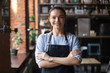 Leinwandbild Motiv Smiling waitress or cafe business owner entrepreneur looking at camera