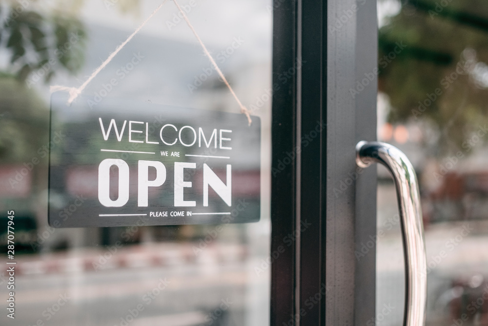 Closeup of open and welcome to store sign board at the door. - obrazy, fototapety, plakaty 