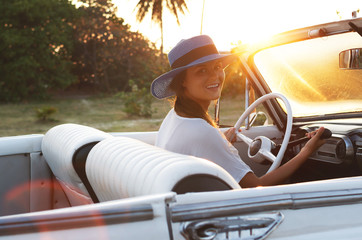 Poster - Happy young woman and retro convertible car