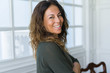 © Krakenimages.com - Beautiful middle age woman at home smiling cheerful with arms crossed