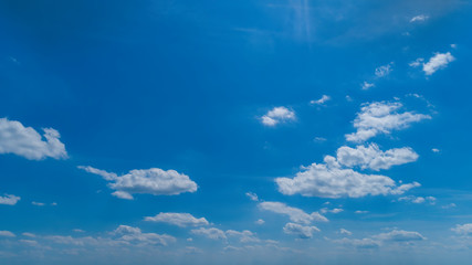 Wall Mural - White Clouds Floating in the Bright Blue Skies