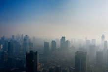 Residential Houses And Skyscrapers With Air Pollution