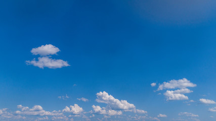 Wall Mural - White Clouds Floating in the Bright Blue Skies