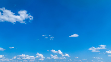 Wall Mural - White Clouds Floating in the Bright Blue Skies