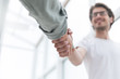 © yurolaitsalbert - close up. young entrepreneur shaking hands with his business partner