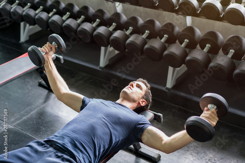 Handsome Weightlifter Lifting Bench Press Working Out With