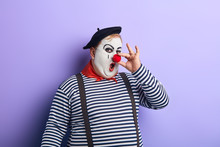Funny Crazy Mime Touching His Nose, Amusing Children In The Party. Close Up Photo. Isolated Blue Background, Studio Shot.