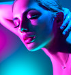 © Subbotina Anna - Fashion model woman in colorful bright neon lights posing in studio. Portrait of beautiful girl in UV. Art design colorful makeup