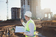 © jozzeppe777 - working engineer talking on the radio at the construction site