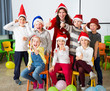 © JackF - Pupils with teacher in Santa hats giving thumbs up