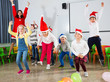 © JackF - Pupils and teacher in Santa hats jumping