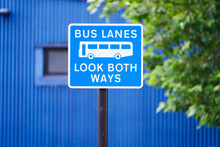 Bus Lanes Sign In City With Look Both Ways Warning
