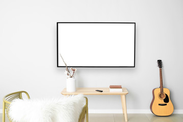 Poster - Table with guitar near light wall in room