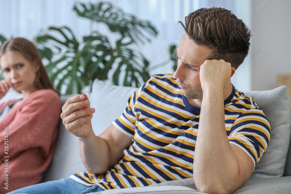 Quarreled couple at home. Concept of divorce