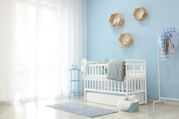 Wall Mural - Interior of light modern baby room with crib