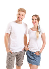 Wall Mural - Couple in stylish t-shirts on white background