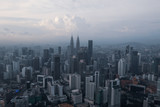 Fototapeta Zwierzęta - Aerial drone view of Kuala Lumpur city skyline during cloudy day
