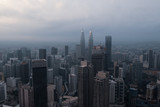 Fototapeta  - Aerial drone view of Kuala Lumpur city skyline during cloudy day