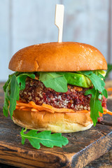 Canvas Print - Vegetarian beetroot burger with avocado and carrot slaw in brioche bun