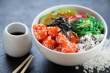 Closeup Of Poke With Salmon Fillet In A White Bowl, Selective Focus, Studio Shot