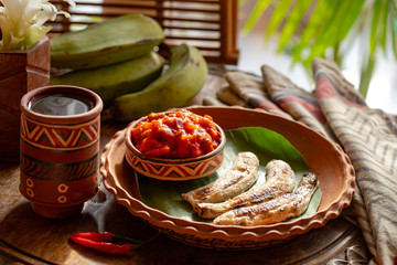 african food. African cuisine called Boli and sauce. fried bananas plantains. Grilled Bananas. African tourism