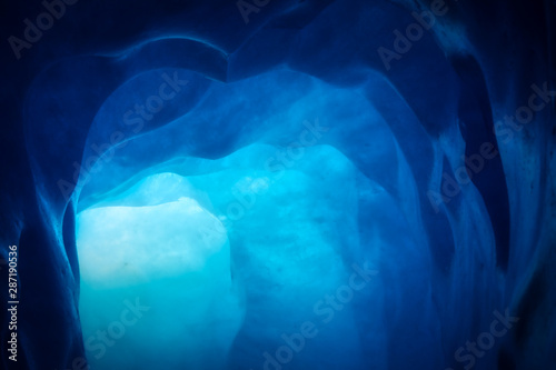 Fotomural blue ice inside a cave under melting rhone glacier