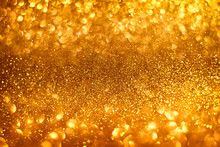 Abstract Gold Sparkles Shiny Defocused Gold Bokeh Lights Background Use Us Gold Luxury Background For Card, Flyer, Invitation, Placard, Voucher Or Banner Background