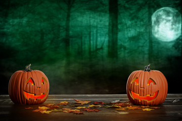 Wall Mural -  two halloween pumpkins with autumn leaves