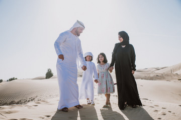 Wall Mural - Arabian family spending a weekend in the desert, in Dubai