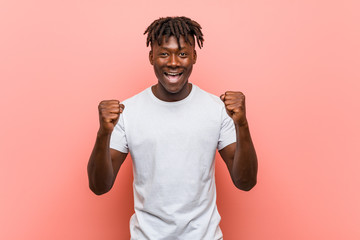 Young african black man cheering carefree and excited. Victory concept.