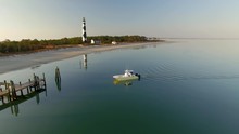 Aerial Shot Docking The Cat Boat Near The Historic Cape Lookout Lighthouse In North Carolina