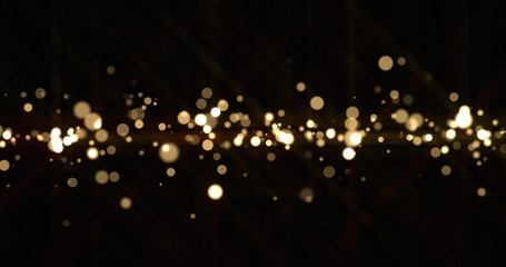 Wall Mural - Gold light bokeh sparks, golden glitter shine. Shiny bright snow bokeh blur effect, shimmering dust light and magic glow sparkles, Christmas luxury background