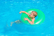 © Augustas Cetkauskas - Happy kid boy having fun in an swimming pool. Active happy healthy preschool child learning to swim. With safe floaties or swimmies.