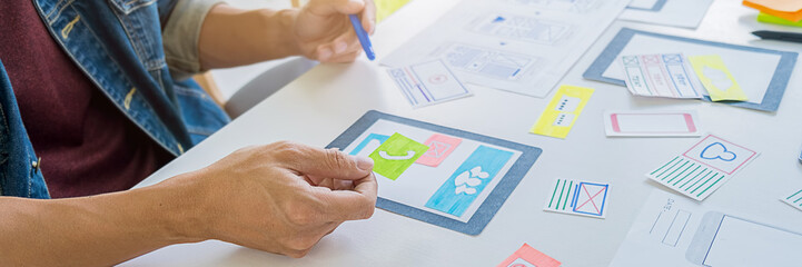 Wall Mural - creative web designer planning application and developing template layout, framework for mobile phon