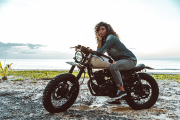 Beautiful woman making a  tour with her motorcycle